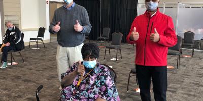 Congressman Schneider and Mayor Leon Rockingham celebrate “Ms. Bee” receiving her COVID vaccine dose
