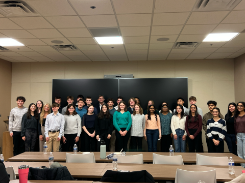 Rep. Schneider stands to take a photo with the 2024 - 2025 STEAM Scholars