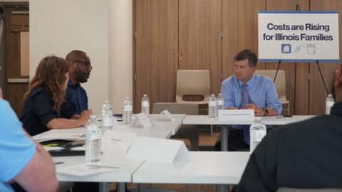 Brad Schneider sits at table with community leaders