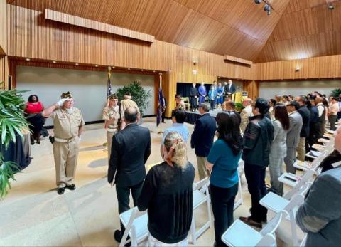 VFW Members saluting the flag.