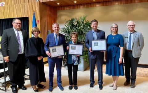 Brad with USCIS officials, and members of congress.