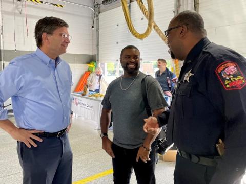 Congressman Schneider Greeting a Citizen and Police Officer