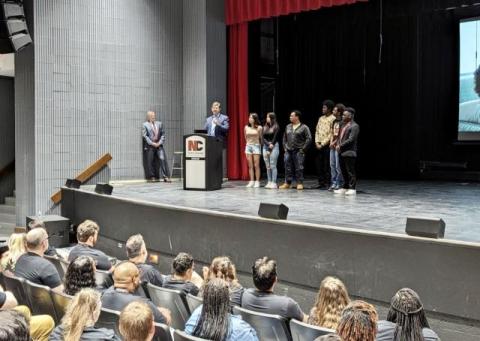 Brad speaking at school assembly. 