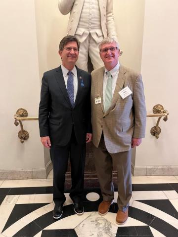 Schneider and Meeting Attendee 