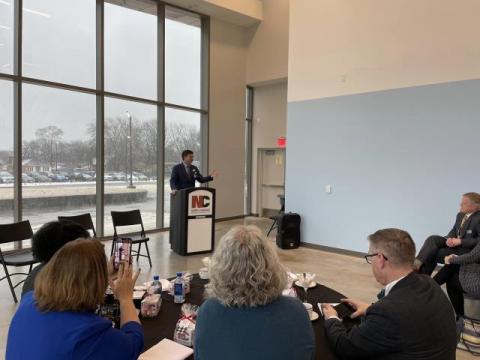 Brad speaking at a podium.