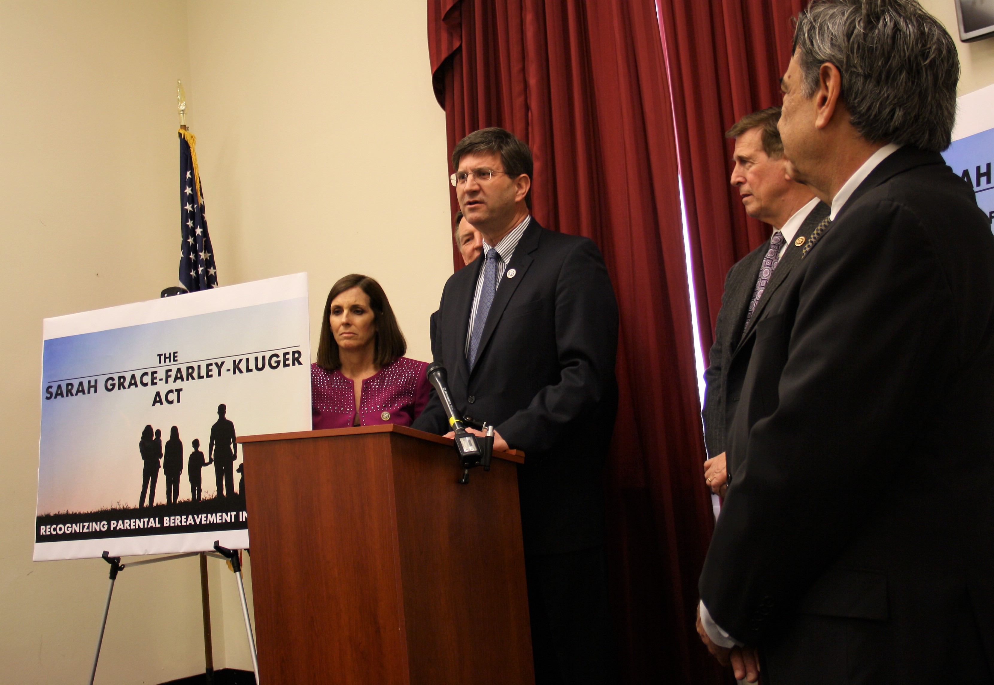 Rep. Schneider at podium