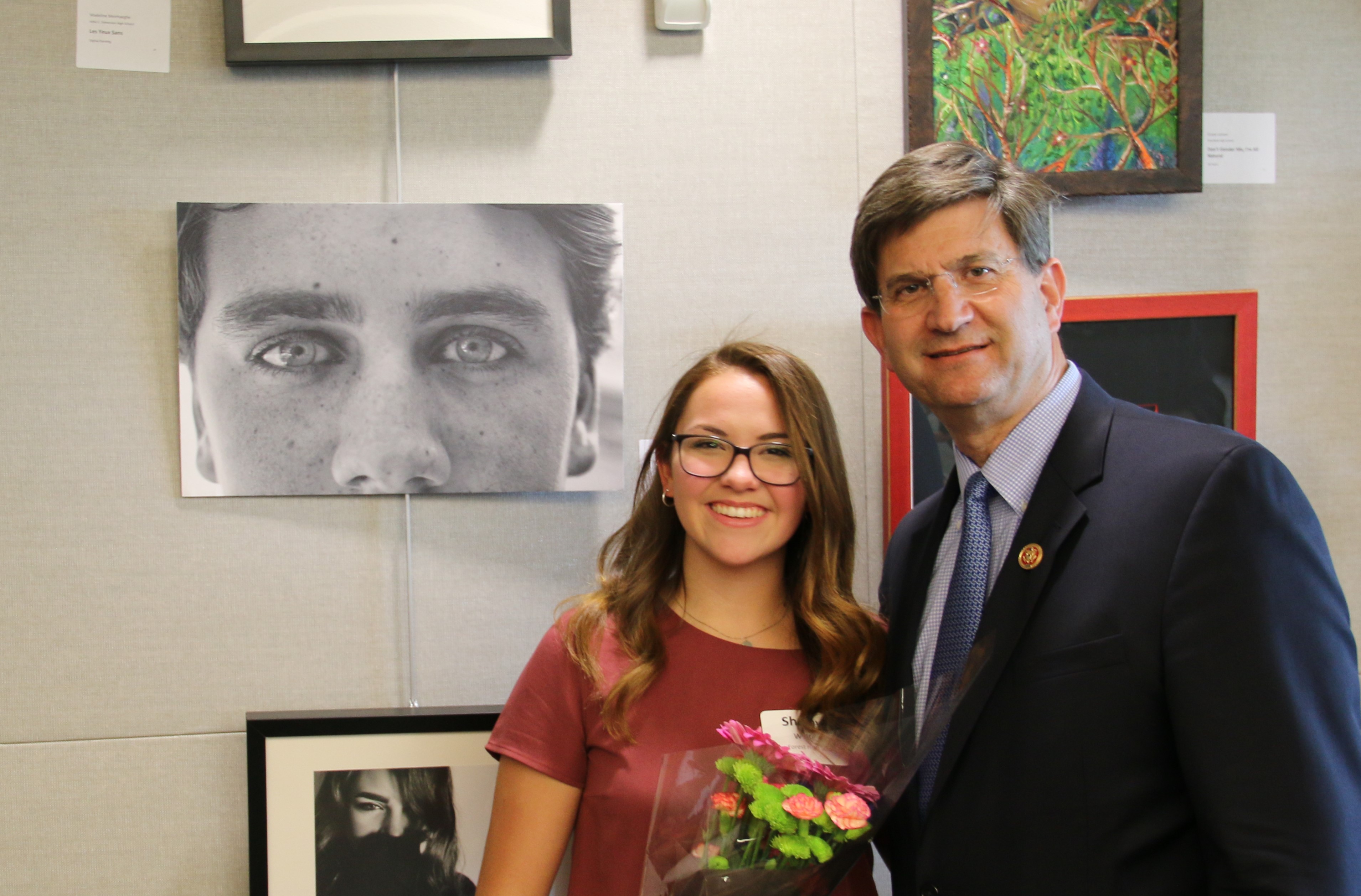Rep. Schneider taking a picture with a woman