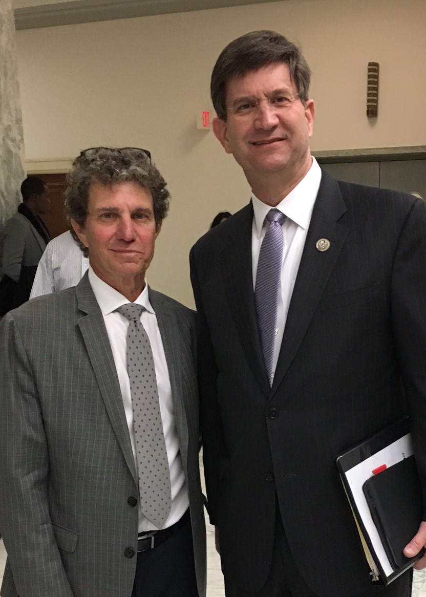 Rep. Schneider taking a picture with a man