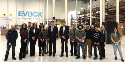Above: Congressman Schneider visits with leaders of EVBox, a local electric vehicle supply equipment company, to discuss federal EV funding