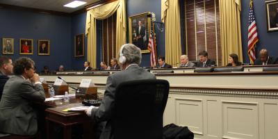 Rep. Schneider on panel at a meeting