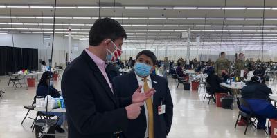 Above: Congressman Brad Schneider discusses the COVID  19 vaccine rollout with Israel Rocha, Cook County Health Department Chief Executive Officer (right)