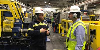 Above: Plant Manager Blake Hunter takes Schneider on tour of Novelis